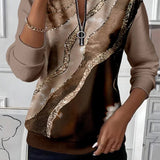 Arlena – moderna bluza s apstraktnim uzorkom i patentnim zatvaračem